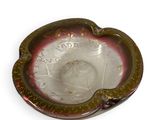a glass ashtray with a picture of a woman on it