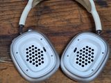 a pair of headphones sitting on a wooden table