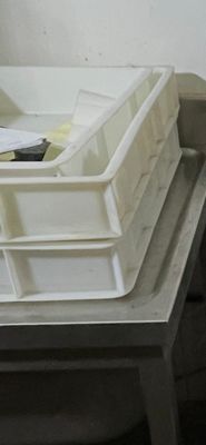 a stack of bins sitting on top of a table
