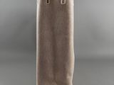 a beige canvas bag with handles on a grey background