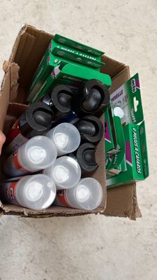 a cardboard box filled with assorted items on the floor