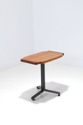 an image of a wooden table with a black metal base