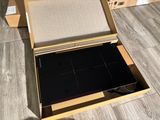 a box that has a laptop inside of it on the floor