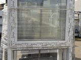 a white window with a blue top on a pallet