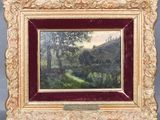 un tableau représentant un paysage avec des arbres dans un cadre doré