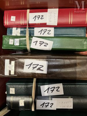 a lot of books that are stacked on top of each other