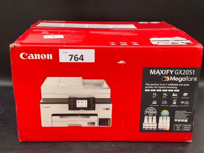 the box of the printer is sitting on the table ready to be used