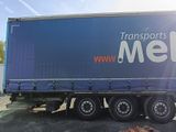 a semi truck that is parked in a parking lot