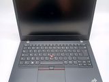 a close up of a laptop computer on a white surface