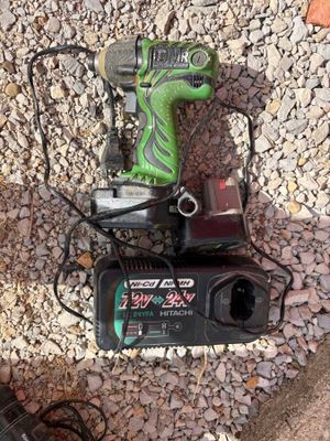 a green corded drill and a black corded corded corded corded corded corded corded corded corded corded corded