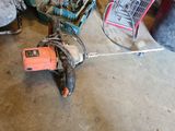 an image of a corded drill in a garage