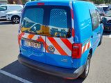 a blue van that is parked in a parking lot
