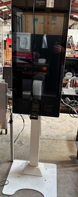 an image of a tv on a stand in a warehouse