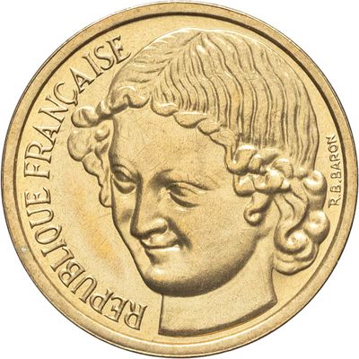 une image montrant un gros plan d'une pièce de monnaie sur laquelle figure le visage d'une femme