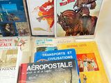several books on a table with a white table cloth