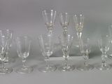 a lot of wine glasses that are sitting on a table