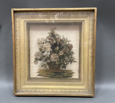 an old picture of a vase of flowers in a gold frame