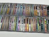 a lot of cassettes that are sitting on a table