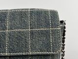 the back of a purse with a chain hanging from it ' s side