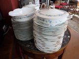 many plates stacked on top of each other on a table