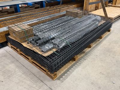 a pile of wire mesh on a pallet in a warehouse
