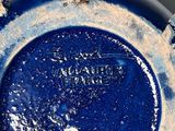 a close up of a blue plate on a table