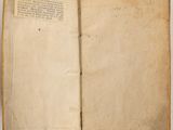 an open book with a page in it sitting on a table