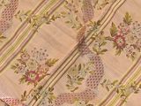 an image of a close up of a quilt with flowers on it