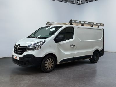 the white van is parked in a large room with a ladder on the roof