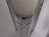 a glass table with a mirror on top of it