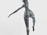 statue of a female dancer on a marble base