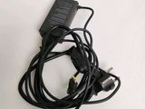 a black power cord that is connected to a charger