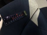 a ruler on the seat of a car that is in the back of the car