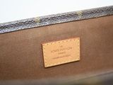 a close up of a louis vuitton bag with a label on it