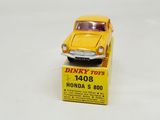 a yellow toy car sitting on top of a box
