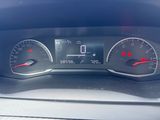 a close up of a car dashboard with a speedometer and gauges