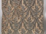 an old piece of cloth with a design on it