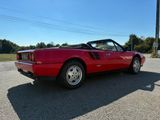 an image of a red sports car parked in a parking lot