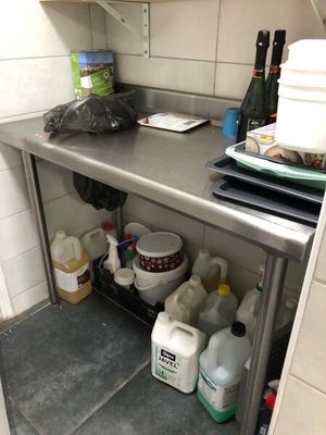 a kitchen with a stainless steel counter top and a sink