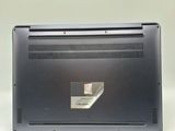 a laptop that is sitting on a white surface