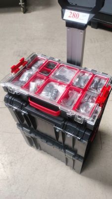 a plastic box with a bunch of screws in it