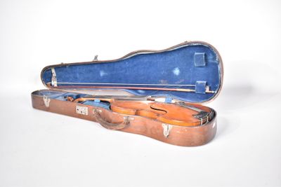 a violin case that is open on a white surface