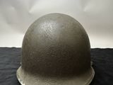 an image of a helmet on a black cloth with a white background