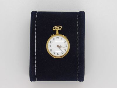 a small pocket watch with a key on it