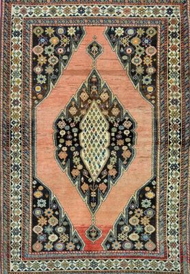 a rug with a diamond design on a black ground
