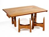 a wooden table with two chairs and a table top