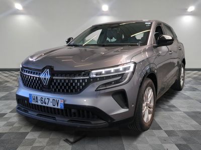 a grey suv parked in a showroom with a checkered floor