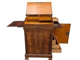 a small wooden desk with a drawer on it