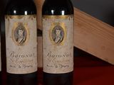 three bottles of wine sitting on top of a table next to a wooden box