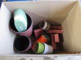 a cardboard box filled with assorted items on the floor